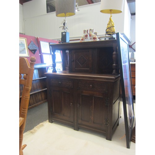 1075 - An 18th Century style carved oak court cupboard, 139cm tall x 120cm wide x 54cm deep  (R)  £40