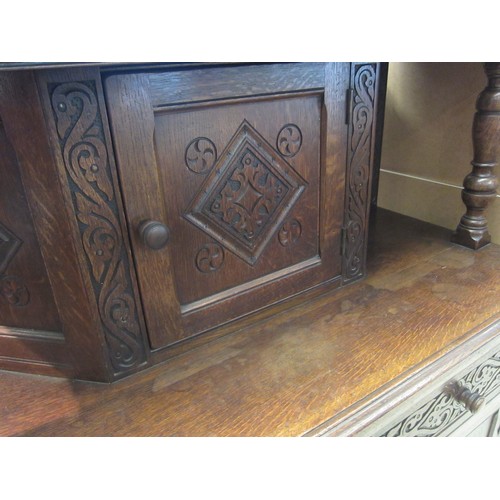 1075 - An 18th Century style carved oak court cupboard, 139cm tall x 120cm wide x 54cm deep  (R)  £40