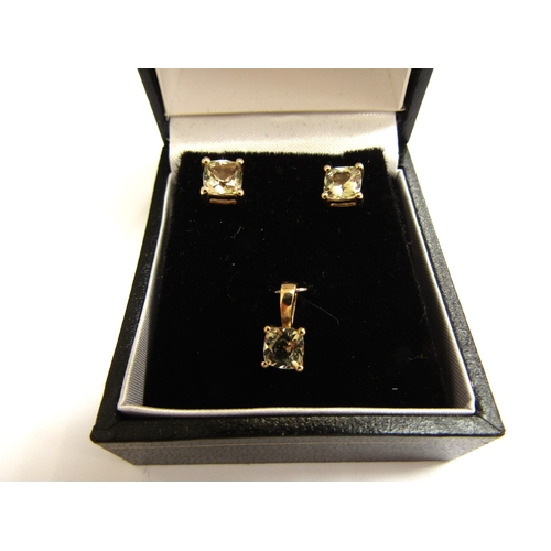 9342 - A pair of 9ct gold csarite stud earrings and a matching pendant, 1.6g               (C)