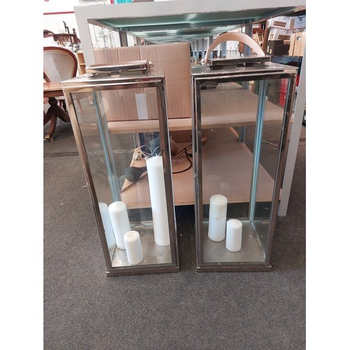 1498 - A pair of chrome effect four glazed panel candle lanterns with leather carrying handles, 78cm x 30cm