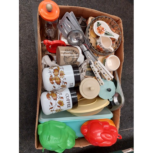 1491 - A box of vintage kitchenalia inc jelly moulds, Horlicks mixer, Tupper-ware etc.