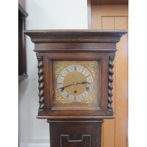 8010 - An early 20th Century oak cased striking and chiming grandmother clock with mainspring driven moveme... 