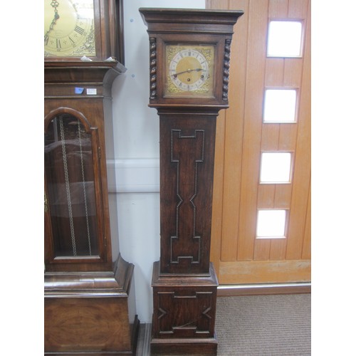 8010 - An early 20th Century oak cased striking and chiming grandmother clock with mainspring driven moveme... 