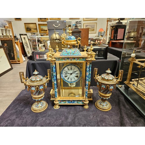 8064 - An early 20th Century highly decorative stirking mantel clock in brass/glazed architectural case wit... 