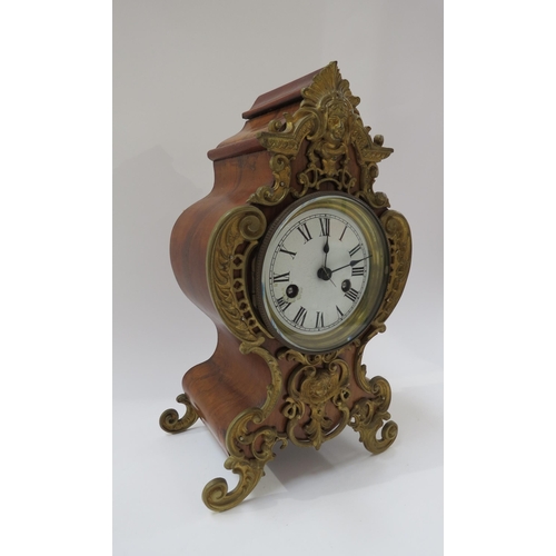 8027 - A French walnut cased striking mantel clock with Roman dial (a/f), brass mounts to case. 30cm high