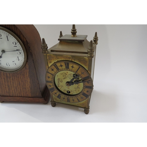 8032 - An Edwardian lancet form oak timepiece with a brass cased timepiece (2)