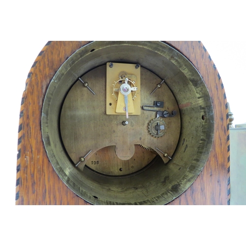 8032 - An Edwardian lancet form oak timepiece with a brass cased timepiece (2)
