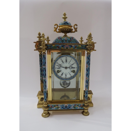 8064 - An early 20th Century highly decorative stirking mantel clock in brass/glazed architectural case wit... 