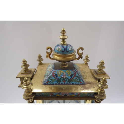 8064 - An early 20th Century highly decorative stirking mantel clock in brass/glazed architectural case wit... 