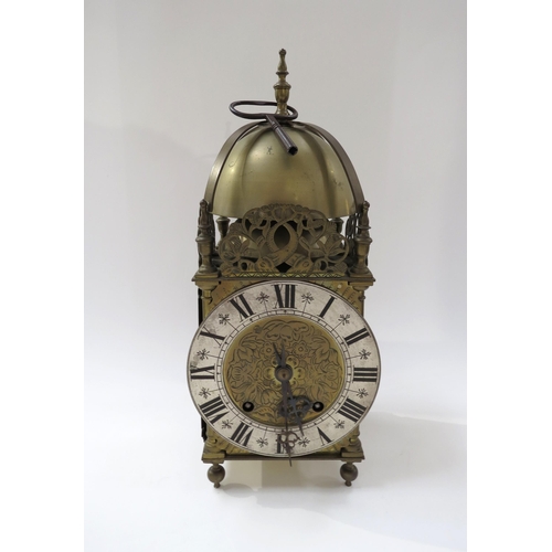 8067 - An early 20th Century brass lantern form striking clock with ting tang quaterly strike on two bells,... 