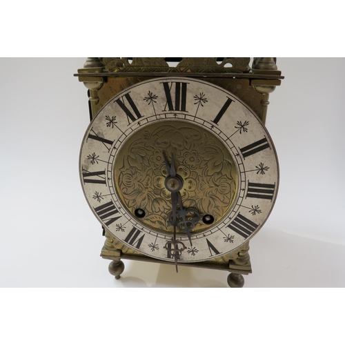 8067 - An early 20th Century brass lantern form striking clock with ting tang quaterly strike on two bells,... 