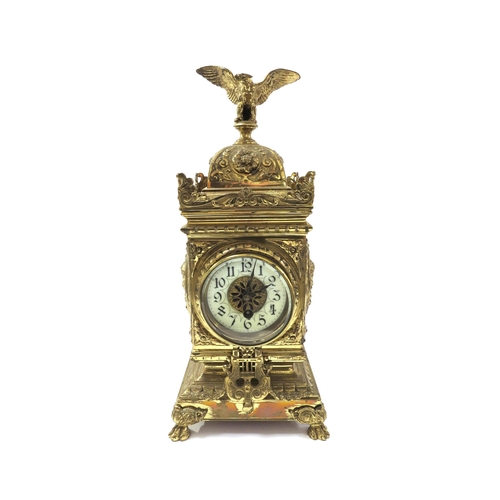 8068 - A French timepiece in highly decorative brass case, Arabic enamelled chapter ring, with pendulum. 42... 