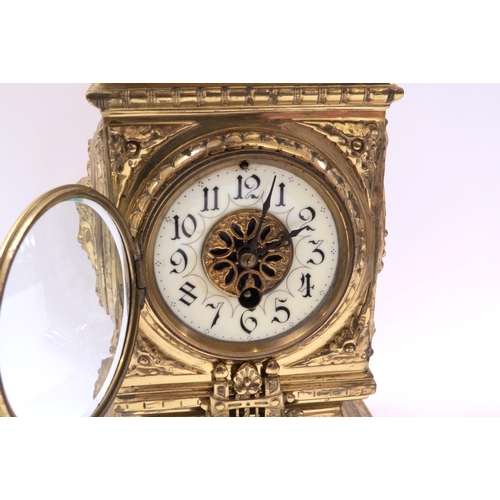 8068 - A French timepiece in highly decorative brass case, Arabic enamelled chapter ring, with pendulum. 42... 