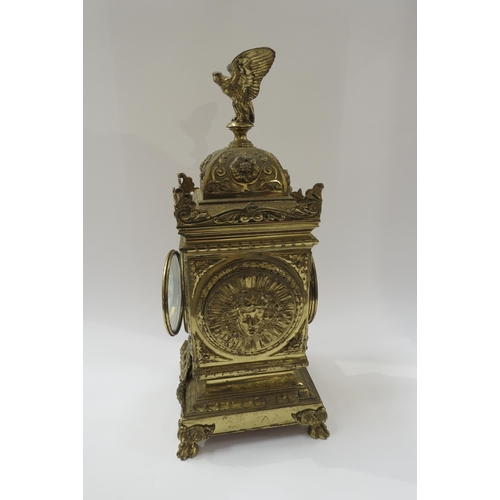 8068 - A French timepiece in highly decorative brass case, Arabic enamelled chapter ring, with pendulum. 42... 