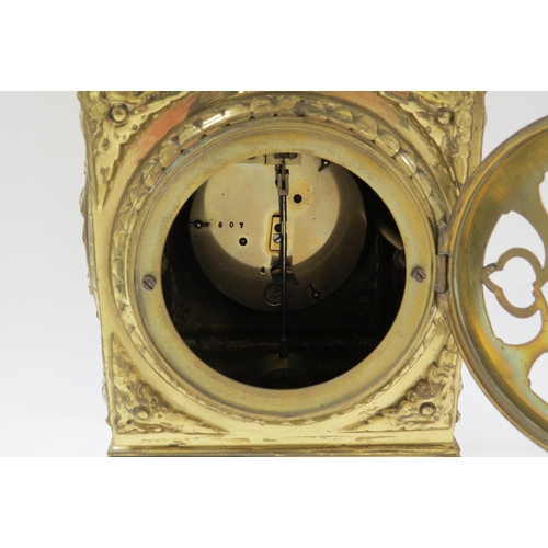 8068 - A French timepiece in highly decorative brass case, Arabic enamelled chapter ring, with pendulum. 42... 