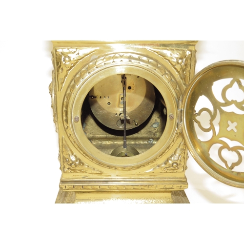 8068 - A French timepiece in highly decorative brass case, Arabic enamelled chapter ring, with pendulum. 42... 