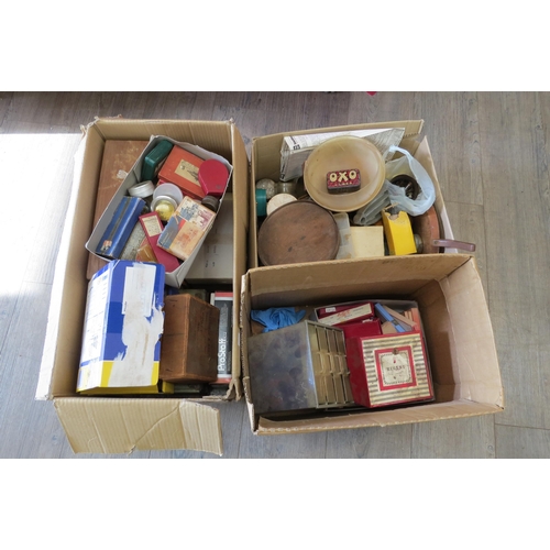 8251 - Three boxes of various watch parts including a large quantity of balance staffs, stems, wheels, move... 