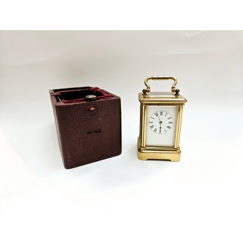 8085 - A miniature brass carriage clock with leather travel case, 8.1cm x 5cm x 4.2cm  (R) £150 Special Ant... 