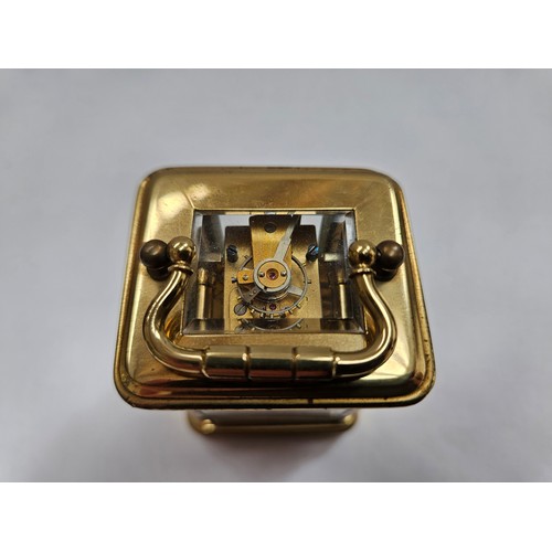 8085 - A miniature brass carriage clock with leather travel case, 8.1cm x 5cm x 4.2cm  (R) £150 Special Ant... 