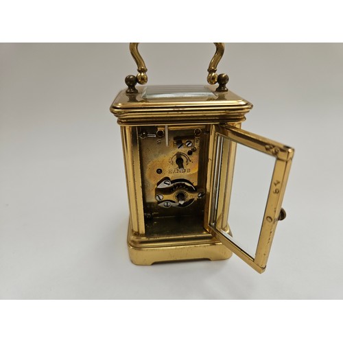 8085 - A miniature brass carriage clock with leather travel case, 8.1cm x 5cm x 4.2cm  (R) £150 Special Ant... 