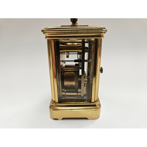 8085 - A miniature brass carriage clock with leather travel case, 8.1cm x 5cm x 4.2cm  (R) £150 Special Ant... 