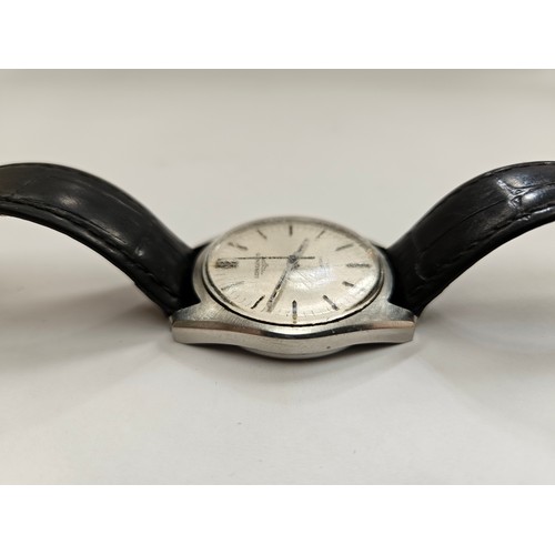 8169A - A Longines Admiral HF wristwatch with baton hour markers, centre seconds and date aperture at 3. On ... 