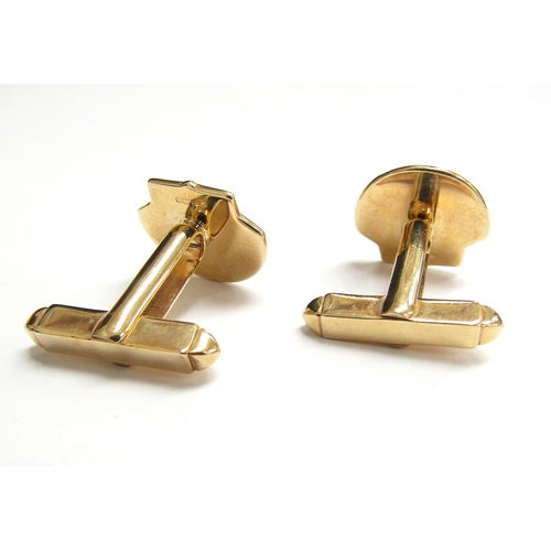 9002 - A pair of 9ct gold cufflinks of shell form set with a small diamond, 10.5g