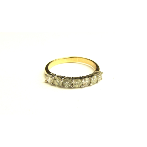 9003 - A gold seven stone diamond half hoop, stamped 750. Size T, 3.6g