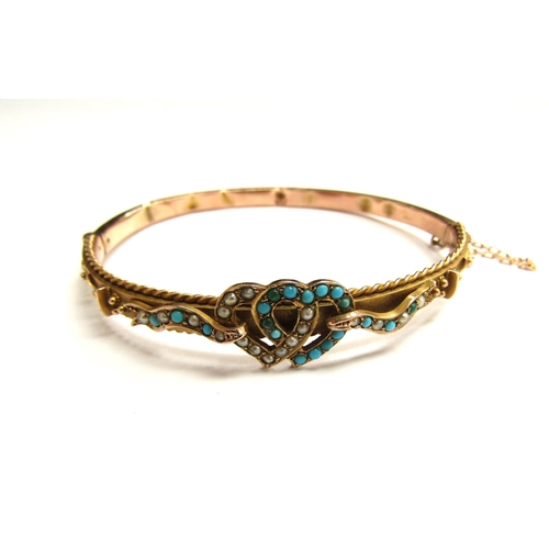 9025 - A Victorian 9ct gold bangle with linked seed pearl and turquoise set hearts, dented, 7.5g