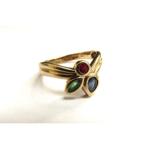 9090 - A 9ct gold ring set with a ruby, sapphire and emerald in rubover settings. Size Q/R, 3.6g