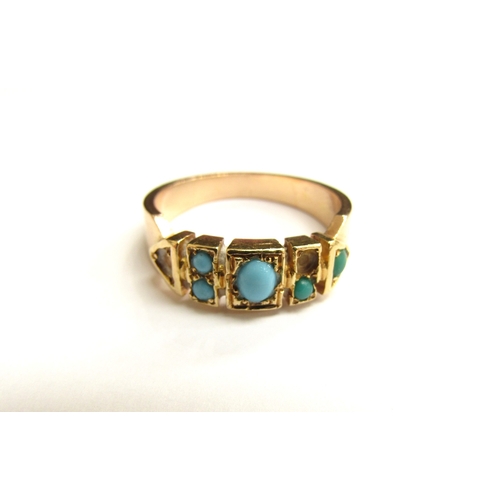 9057 - An unmarked gold ring set with turquoise cabochons, two missing. Size Q, 6.1g