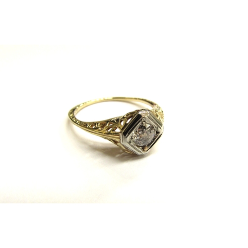 9346 - A gold diamond ring with engraved shank, stamped 14ct and 19ct. Size L/M, 2g                 (C)