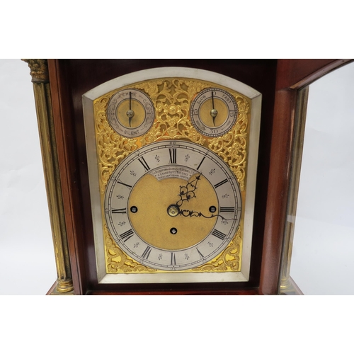 8058 - A late 19th Century oak and inlaid bracket clock with silvered Roman chapter ring over gilded mask. ... 