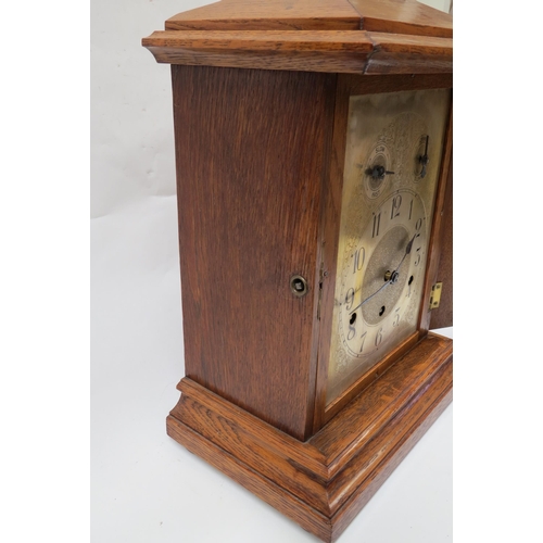 8061 - An early 20th Century oak cased striking and chiming, silvered arch dial with Arabic chapter ring pl... 