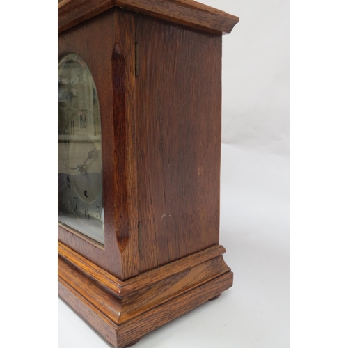 8061 - An early 20th Century oak cased striking and chiming, silvered arch dial with Arabic chapter ring pl... 