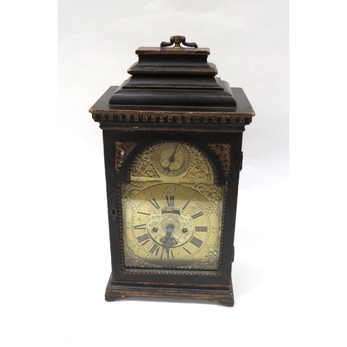 8065 - An 18th Century bracket clock in ebonised case. Roman brass chapter ring with applied spandrels and ... 