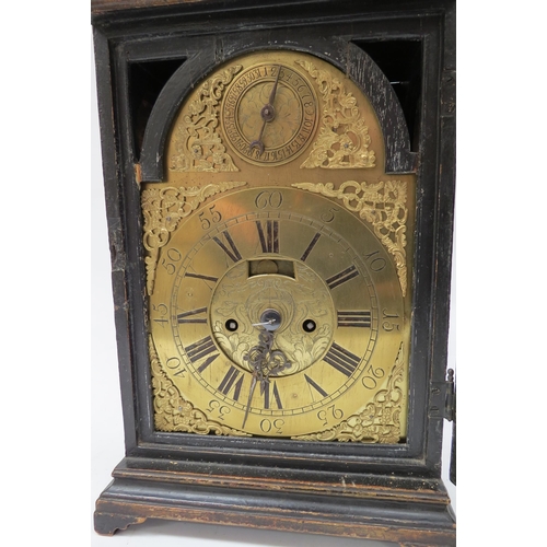 8065 - An 18th Century bracket clock in ebonised case. Roman brass chapter ring with applied spandrels and ... 