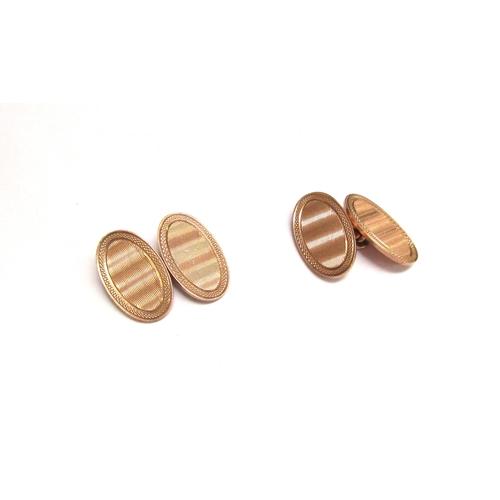 9376 - A pair of 9ct gold cufflinks, engine turned detail, 8.2g