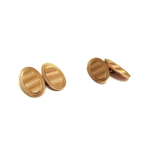 9376 - A pair of 9ct gold cufflinks, engine turned detail, 8.2g