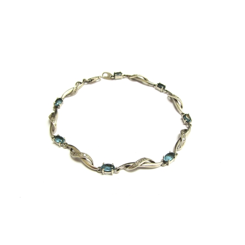 9269 - A 9ct white gold, topaz and diamond bracelet, 18.5cm long, 5.5g