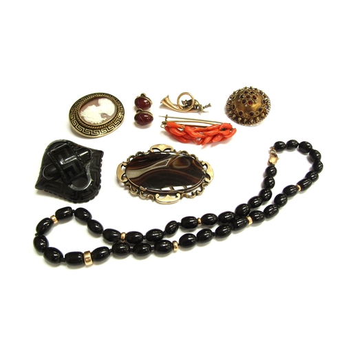 9453 - A Victorian jet brooch, a coral brooch, oval agate brooch and a jet bead brooch with gold clasp etc