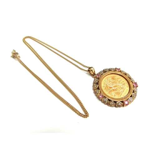 9256 - A 2006 gold half sovereign in a 9ct gold diamond and pink sapphire mount hung on gold chain clasp st... 