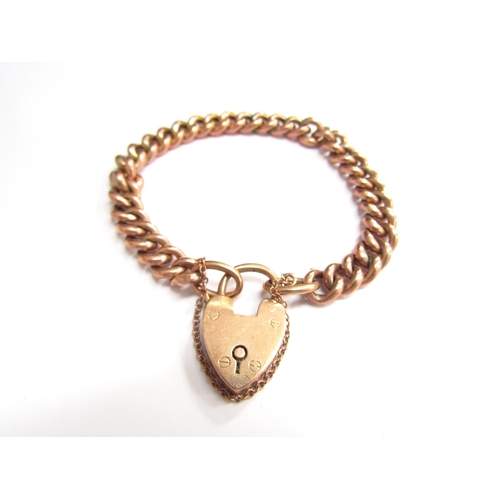 9416 - A 9ct gold hollow link bracelet with padlock clasp, 18cm long, 11.5g