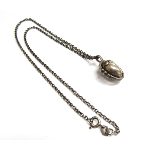 9438 - A Georg Jensen silver pendant as an acorn hung on silver chain, 41cm long, boxed