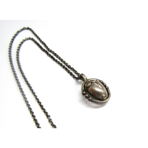 9438 - A Georg Jensen silver pendant as an acorn hung on silver chain, 41cm long, boxed