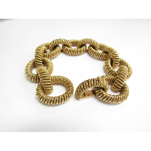 9329 - A Boucheron Paris 18ct gold bracelet with heavy oval textured links, French gold marks, 20cm long, 1... 