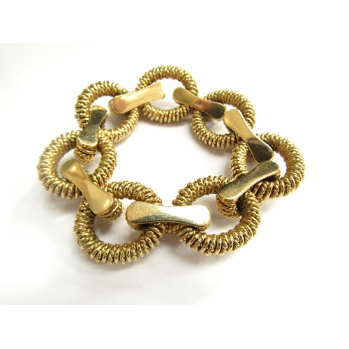 9329 - A Boucheron Paris 18ct gold bracelet with heavy oval textured links, French gold marks, 20cm long, 1... 