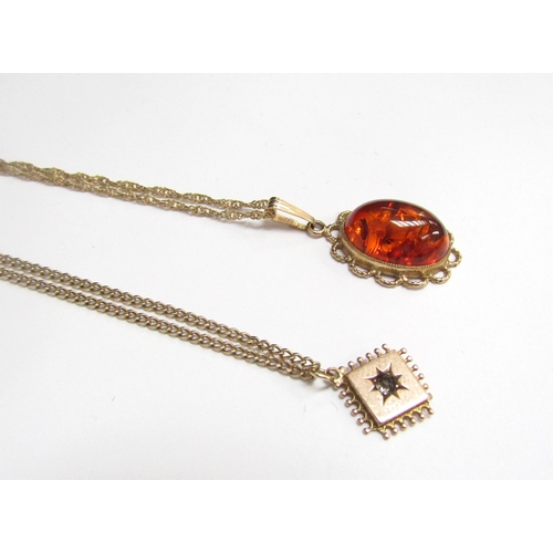 9124 - A 9ct gold twist chain 50cm long hung with  a9ct gold amber pendant and a gold chain with square for... 