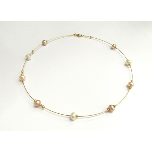 9466 - A 9ct gold wire necklace interspersed with gold beads and pearls, 40cm long, 6g