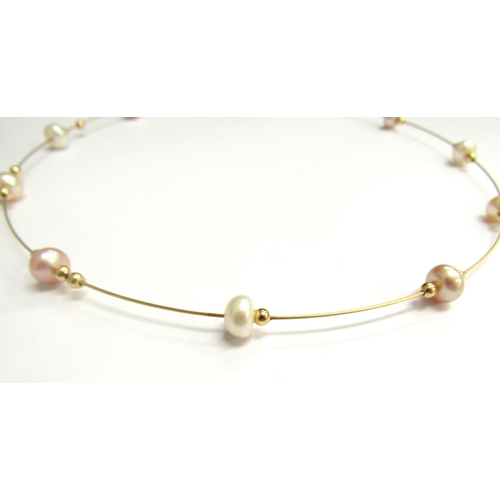 9466 - A 9ct gold wire necklace interspersed with gold beads and pearls, 40cm long, 6g